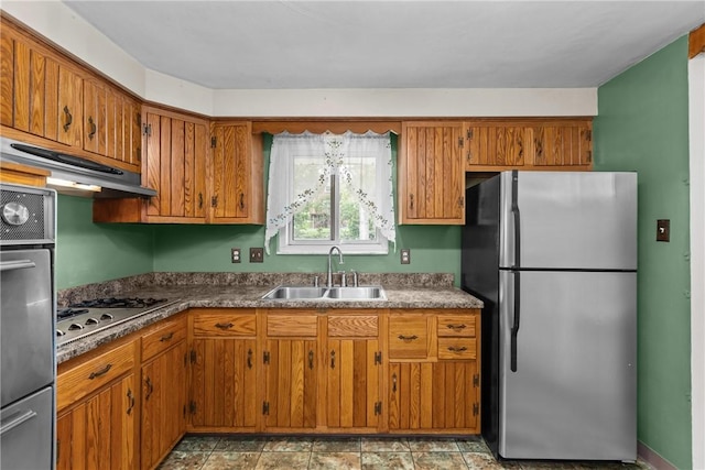 433 Wyndhurst Dr, Moon/Crescent Twp, PA 15108 - kitchen with stainless steel appliances, brown cabinets, and under cabinet range hood