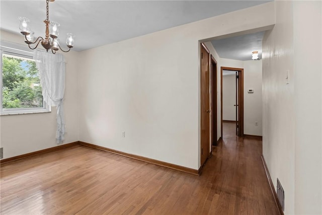 433 Wyndhurst Dr, Moon/Crescent Twp, PA 15108 - unfurnished room with a chandelier and wood finished floors