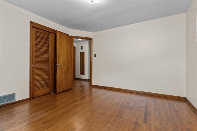 433 Wyndhurst Dr, Moon/Crescent Twp, PA 15108 - unfurnished bedroom with wood finished floors and a closet