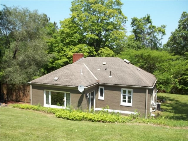 243 Byron Rd, Ross Twp, PA 15237 - rear view of property with a chimney, a yard, and roof with shingles
