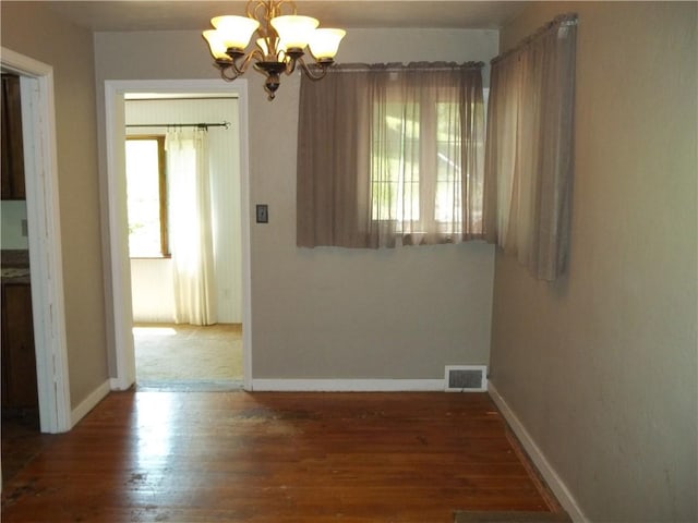 243 Byron Rd, Ross Twp, PA 15237 - unfurnished dining area with a chandelier and wood finished floors