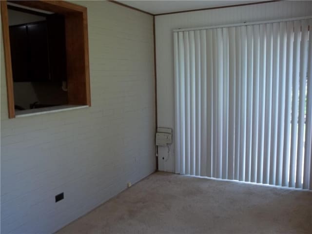 243 Byron Rd, Ross Twp, PA 15237 - unfurnished room featuring carpet flooring and brick wall