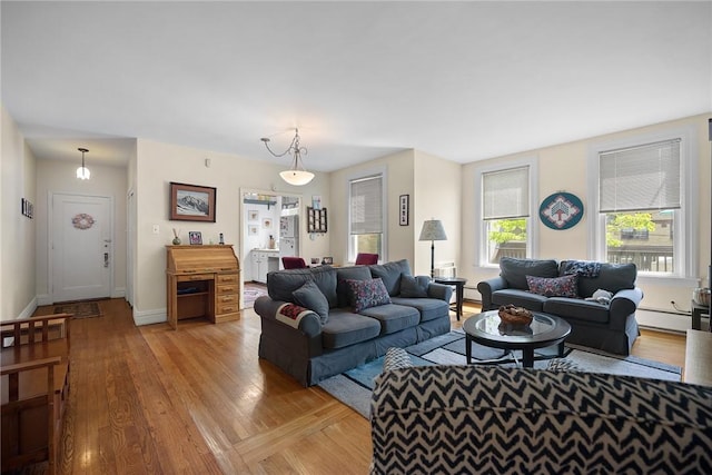 225 E Swissvale Ave Unit 2, Edgewood, PA 15218 - living area with a baseboard heating unit and light wood finished floors