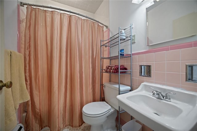 225 E Swissvale Ave Unit 2, Edgewood, PA 15218 - bathroom with tile walls, curtained shower, and a baseboard heating unit