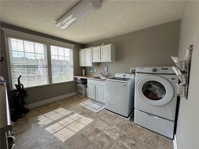 30 Trotter Ln, Findlay Twp, PA 15026 - laundry area featuring cabinet space, washer and dryer, a textured ceiling, and light stone finish floors
