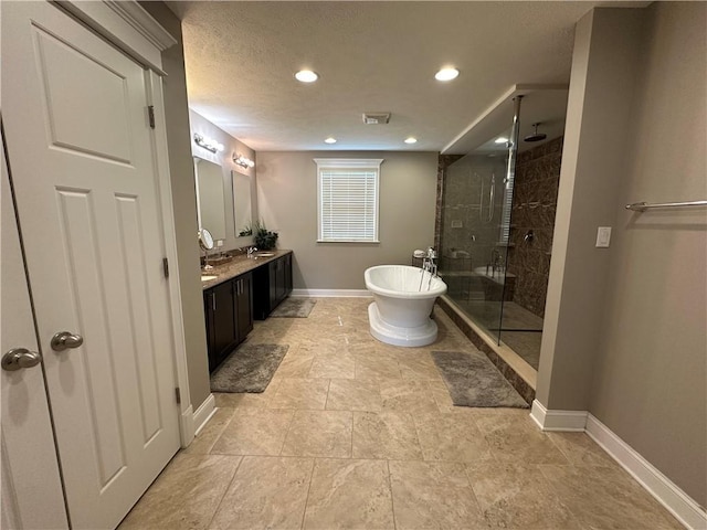 30 Trotter Ln, Findlay Twp, PA 15026 - full bathroom featuring a stall shower, double vanity, a freestanding bath, recessed lighting, and a textured ceiling