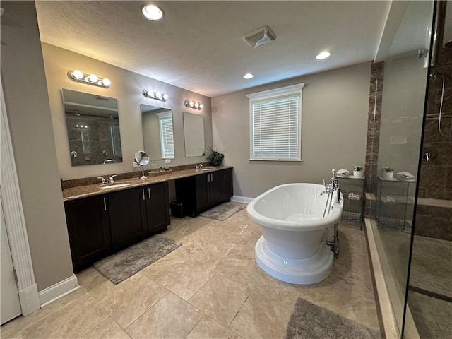 30 Trotter Ln, Findlay Twp, PA 15026 - full bathroom featuring tiled shower, a freestanding tub, double vanity, and recessed lighting