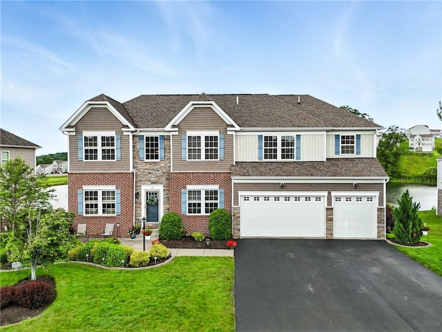 30 Trotter Ln, Findlay Twp, PA 15026 - view of front of home featuring asphalt driveway, a garage, a front yard, and stone siding