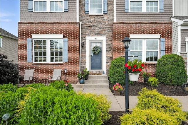 30 Trotter Ln, Findlay Twp, PA 15026 - view of exterior entry with stone siding and brick siding
