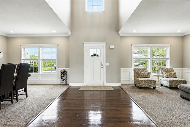 30 Trotter Ln, Findlay Twp, PA 15026 - foyer featuring healthy amount of natural light, wood-type flooring, crown molding, a wainscoted wall, and a decorative wall