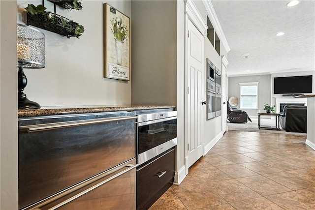 30 Trotter Ln, Findlay Twp, PA 15026 - kitchen with oven, recessed lighting, stainless steel oven, light tile patterned floors, and ornamental molding