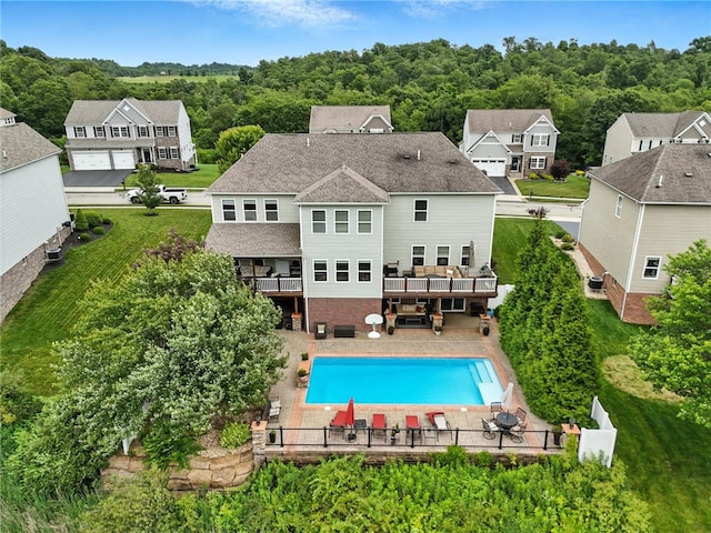 30 Trotter Ln, Findlay Twp, PA 15026 - rear view of house with a patio, an outdoor pool, a balcony, and a residential view