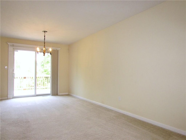 6921 Spring Valley Ln, Murrysville, PA 15632 - spare room with light colored carpet and a chandelier