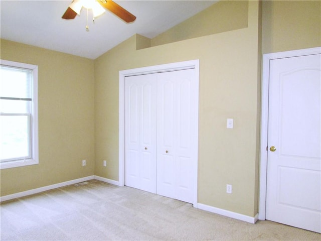 6921 Spring Valley Ln, Murrysville, PA 15632 - unfurnished bedroom with vaulted ceiling, a closet, light colored carpet, and ceiling fan