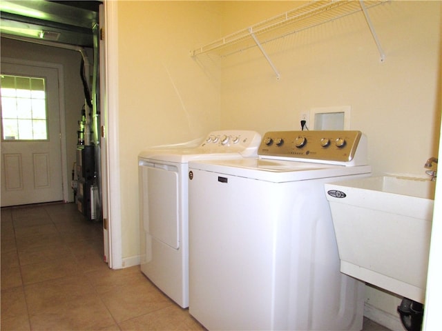 6921 Spring Valley Ln, Murrysville, PA 15632 - laundry area featuring washing machine and dryer and light tile patterned floors