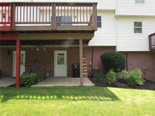 6921 Spring Valley Ln, Murrysville, PA 15632 - back of house featuring a yard, brick siding, a patio area, and a deck