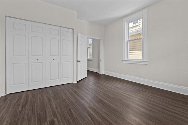 4506 Bowes Ave, West Mifflin, PA 15122 - unfurnished bedroom with dark wood finished floors and a closet