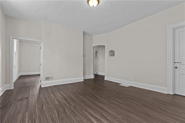 4506 Bowes Ave, West Mifflin, PA 15122 - unfurnished room featuring arched walkways and dark wood-type flooring