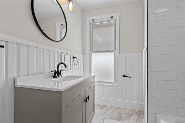 4506 Bowes Ave, West Mifflin, PA 15122 - full bathroom featuring marble look tiles, vanity, and a wainscoted wall