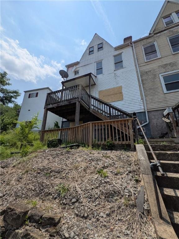 709 Fruit Way, Mckees Rocks, PA 15136 - rear view of house with stairs, a deck, and a chimney