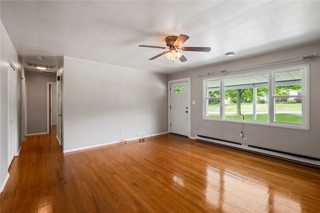 2485 Victoria Dr, Hermitage, PA 16148 - spare room featuring a baseboard radiator, wood finished floors, and a ceiling fan
