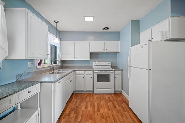 2485 Victoria Dr, Hermitage, PA 16148 - kitchen with white appliances, light wood-style floors, white cabinetry, and pendant lighting