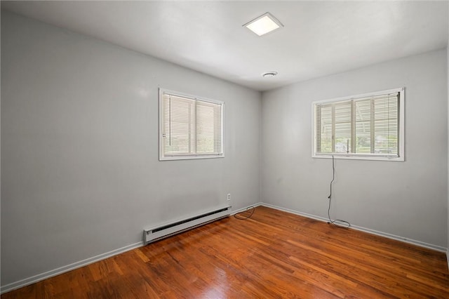 2485 Victoria Dr, Hermitage, PA 16148 - unfurnished room with baseboard heating and wood finished floors