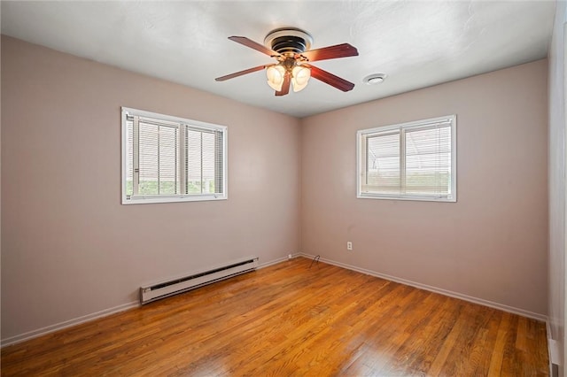 2485 Victoria Dr, Hermitage, PA 16148 - unfurnished room with a baseboard radiator, plenty of natural light, light wood finished floors, and a ceiling fan