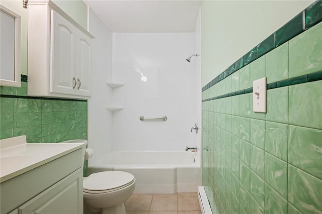 2485 Victoria Dr, Hermitage, PA 16148 - full bathroom featuring tile walls, vanity, tile patterned flooring, bathtub / shower combination, and a baseboard radiator