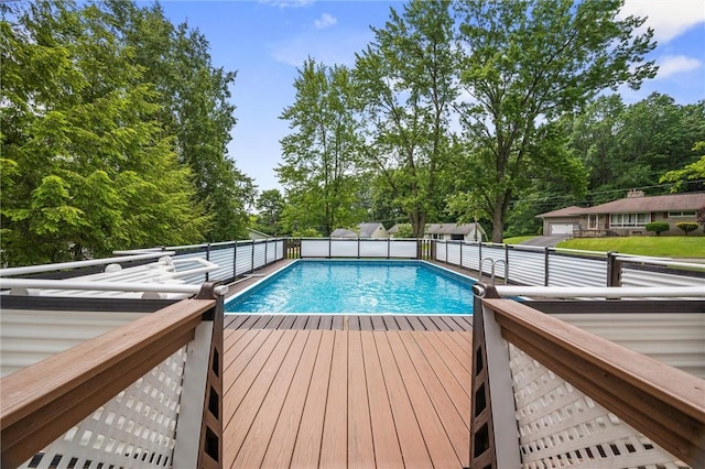 2485 Victoria Dr, Hermitage, PA 16148 - swimming pool featuring a wooden deck and view of wooded area
