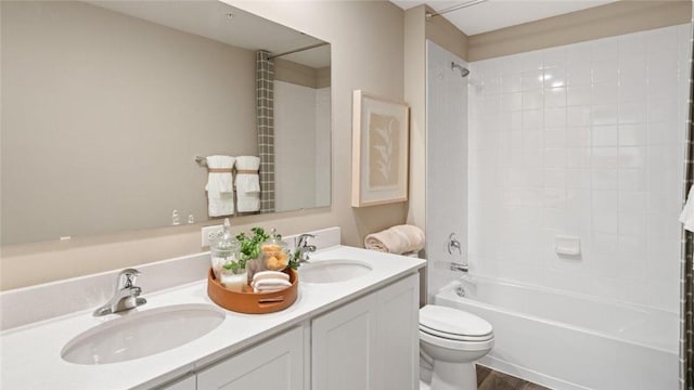 364 Leslie Farms Dr, Connoquenessing Boro, PA 16033 - bathroom featuring double vanity, shower / bath combination, and wood finished floors
