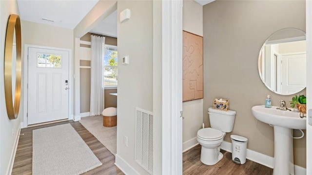 364 Leslie Farms Dr, Connoquenessing Boro, PA 16033 - half bath with wood finished floors and toilet