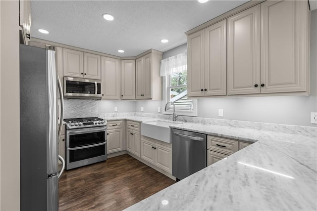 710 Duncan Ave, City Of Washington, PA 15301 - kitchen featuring appliances with stainless steel finishes, recessed lighting, dark wood-style flooring, a textured ceiling, and light stone countertops