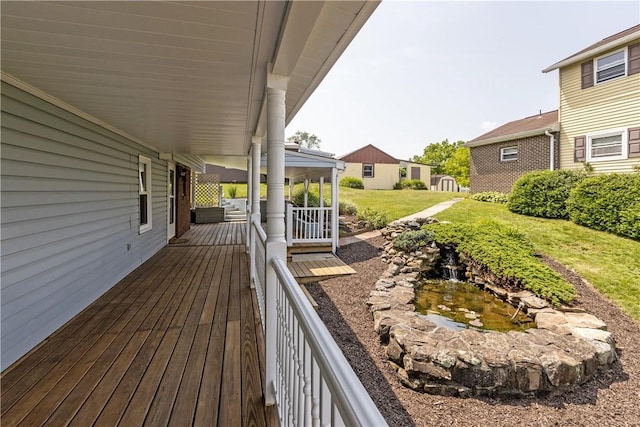 217 Orchard St, West Deer, PA 15006 - wooden porch with a small pond and a lawn