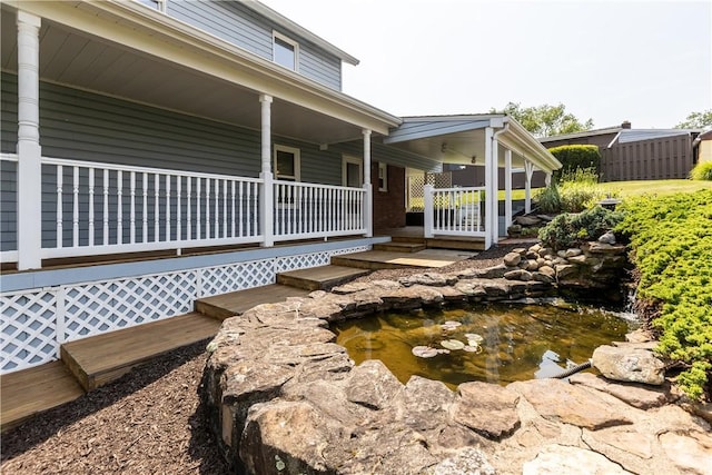 217 Orchard St, West Deer, PA 15006 - view of side of property with a garden pond and a porch
