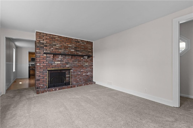 217 Orchard St, West Deer, PA 15006 - unfurnished living room featuring carpet flooring and a fireplace