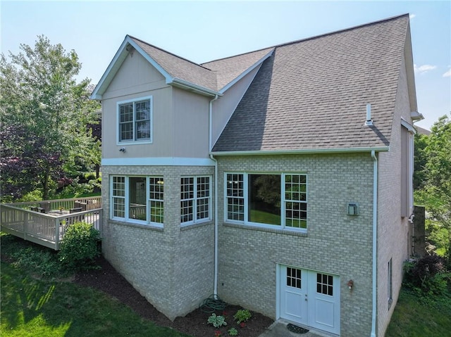 2023 Sterling Dr, South Fayette, PA 15057 - view of home's exterior with a deck, roof with shingles, and brick siding