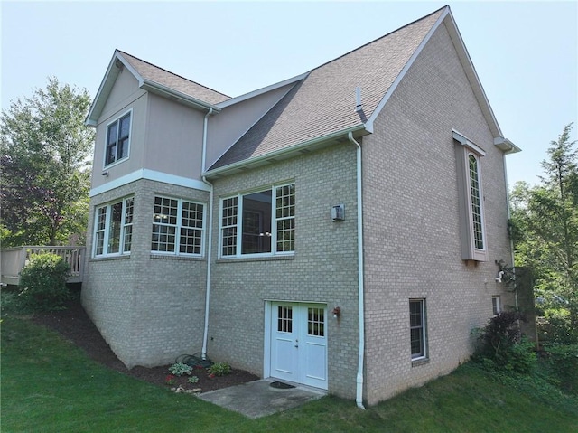 2023 Sterling Dr, South Fayette, PA 15057 - back of property featuring brick siding, roof with shingles, and a yard