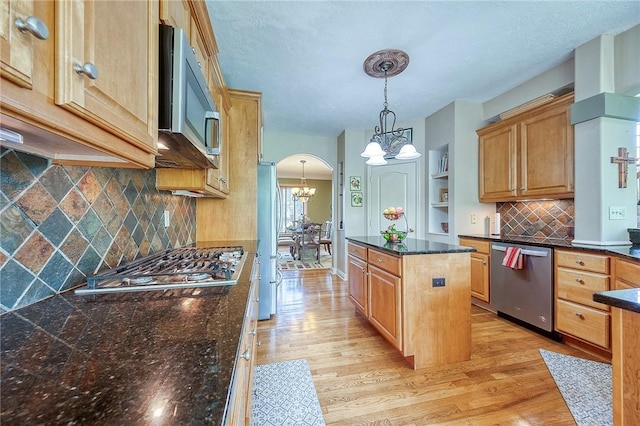 2023 Sterling Dr, South Fayette, PA 15057 - kitchen featuring appliances with stainless steel finishes, a chandelier, light wood finished floors, and a kitchen island