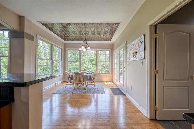 2023 Sterling Dr, South Fayette, PA 15057 - dining area with a chandelier, healthy amount of natural light, light wood finished floors, crown molding, and an ornate ceiling