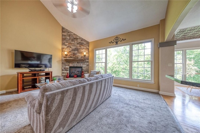 2023 Sterling Dr, South Fayette, PA 15057 - living area with plenty of natural light, a stone fireplace, a ceiling fan, and high vaulted ceiling