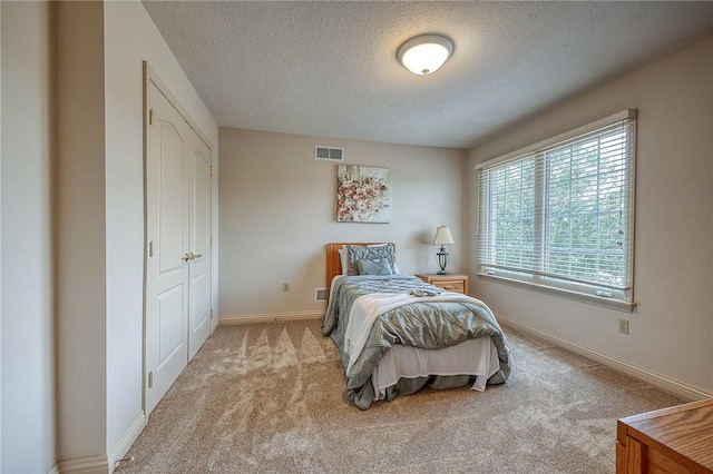 2023 Sterling Dr, South Fayette, PA 15057 - carpeted bedroom with a textured ceiling and baseboards