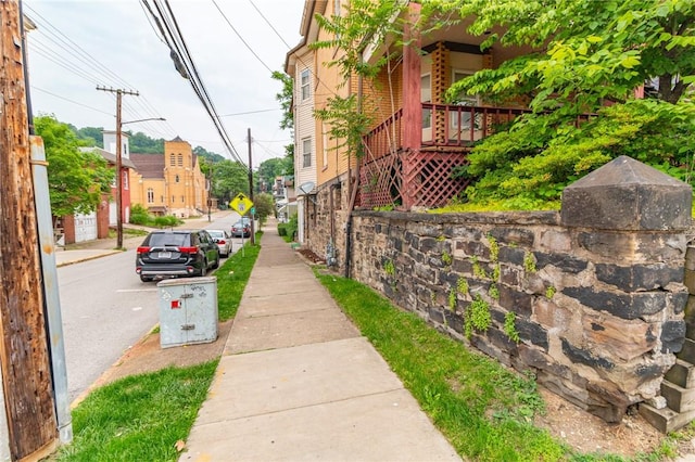 502 3rd St, Pitcairn, PA 15140 - view of asphalt road with sidewalks, traffic signs, and curbs