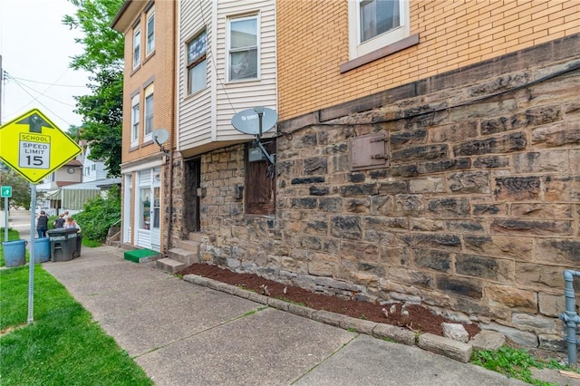 502 3rd St, Pitcairn, PA 15140 - view of side of home featuring stone siding