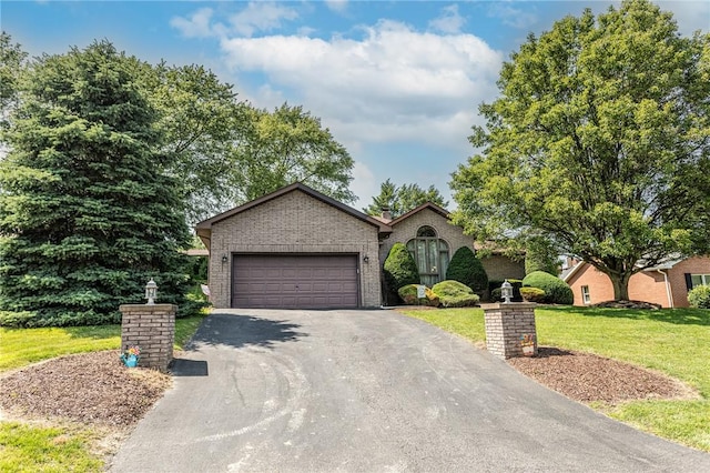 406 Dove Dr, South Union Twp, PA 15401 - view of front of property with driveway, a front lawn, brick siding, and an attached garage
