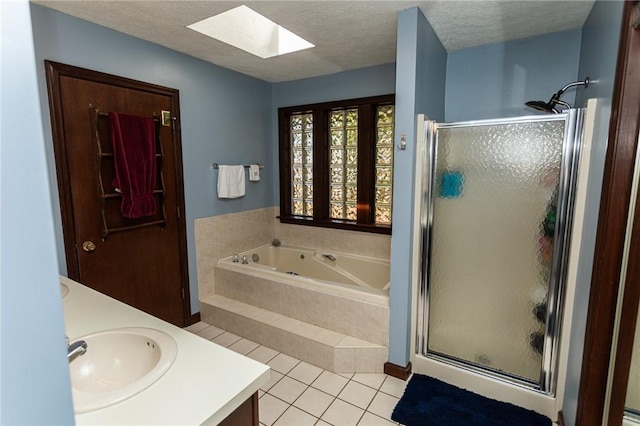 406 Dove Dr, South Union Twp, PA 15401 - bathroom with a skylight, a shower stall, double vanity, a jetted tub, and a textured ceiling