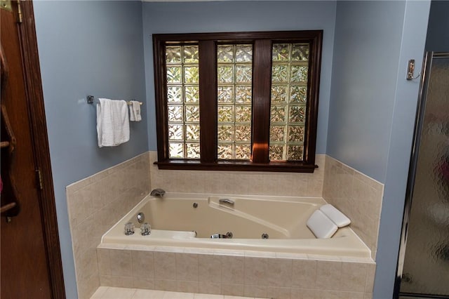 406 Dove Dr, South Union Twp, PA 15401 - bathroom featuring healthy amount of natural light, a jetted tub, and a shower stall