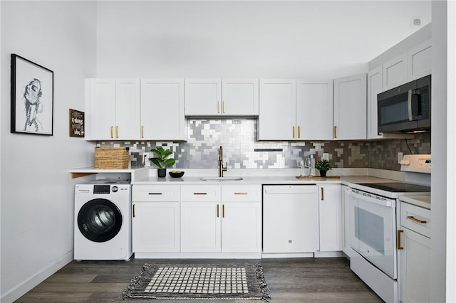 5850 Centre Ave Unit 605, Shadyside, PA 15206 - kitchen with white appliances, washer / dryer, tasteful backsplash, dark wood-style floors, and light countertops