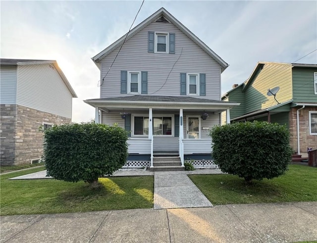 203 10th, St, PA 15963 - view of front facade with covered porch and a front yard