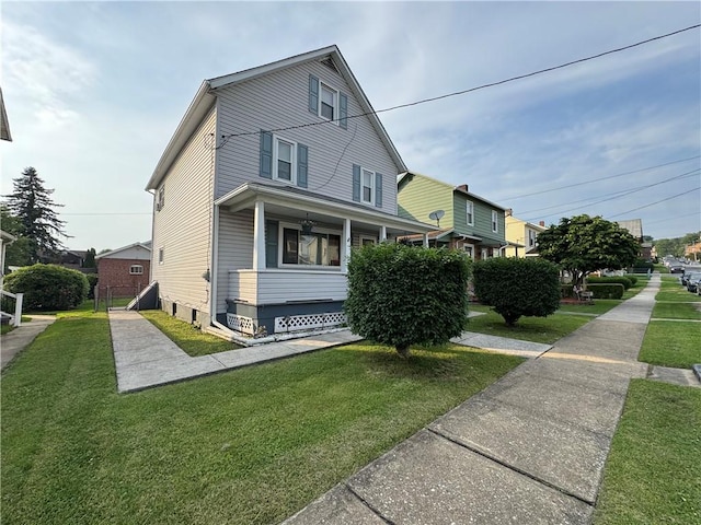 203 10th, St, PA 15963 - view of property exterior with a lawn and covered porch